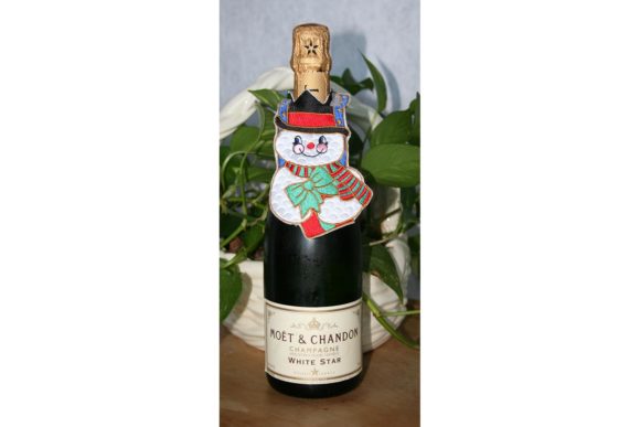 Creative Fabrica's Snowman Bottle Dress Embroidery Design: A Seller's Review
